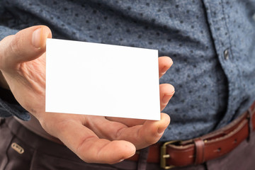 Business man holding a business card