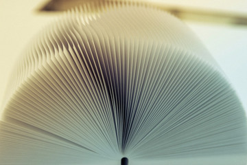 Macro view of book pages, as a background, white background.