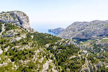 Panoramic view over the steep coastline of the massif des Calanques on the mediterranean shore in...
