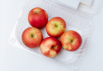Apple in plastic container