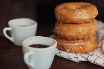 Coffee cup with sugar donut
