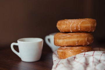 Coffee cup with sugar donut