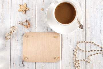 Cup of coffee and wooden board