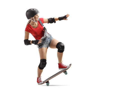 Skater girl with a skateboard and helmet