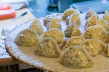 several fresh homemade asian dumplings
