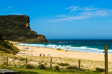 View onto the white empty Garie Beach in the Royal National Park near Sydney in summer with clear sky (Sydney, Australia)