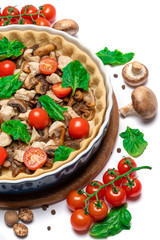 Traditional quiche tart in baking form with filling