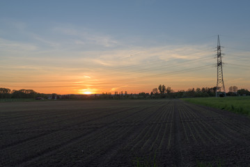 Sunset behind a field