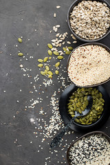 Ketogenic low carbs diet concept. Healthy eating and dieting. Ketogenic kitchen recipes: bread or crackers from seeds without flour, sugar. Quinoa, sesame, pumpkin seeds, sunflower seeds. Ingredients