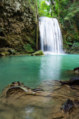 Fototapeta na wymiar Erawan Falls (The third waterfall – Pha Nam Tok) with emerald green pond in Erawan National Park.
