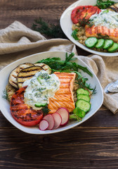 Grilled salmon, eggplants and tomatoes with quinoa and tzatziki sauce