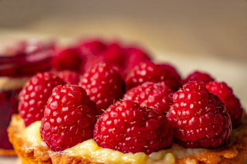 Raspberries on a cake close-up