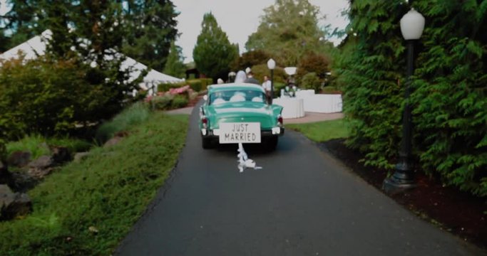 Old time Car with Just Married Sign Cans