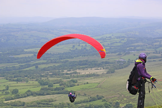 Paraglider flying in the Brecon Beacons, Wales