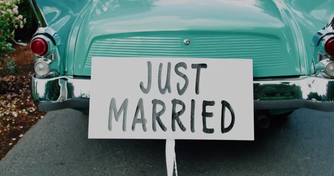 Old time Car with Just Married Sign Cans
