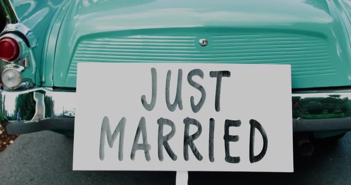 Old time Car with Just Married Sign Cans