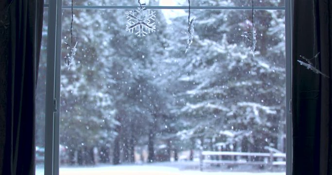 Snowfall Through a Window