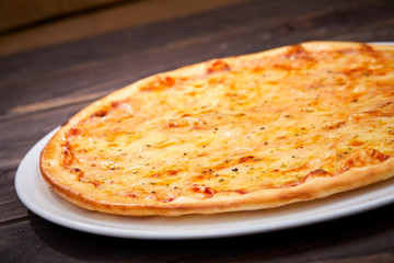 pizza on the wooden background