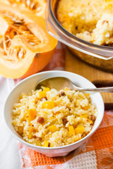 Milky cereal porridge with pumpkin and raisins