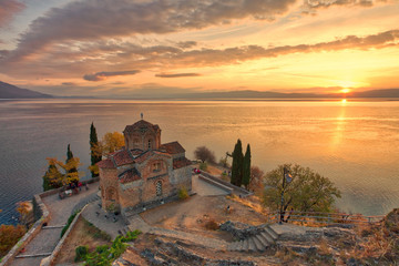 Historic Church of Saint John the Theologian, situated on the cliff over Kaneo Beach overlooking Lake Ohrid in the city of Ohrid, Republic of Macedonia - obrazy, fototapety, plakaty