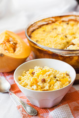 Milky cereal porridge with pumpkin and raisins