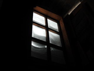 Snow on the window in the old house