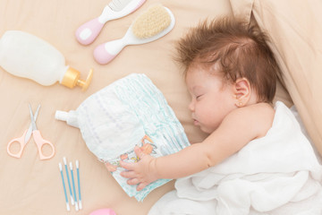 Cute baby girl sleeping safely.