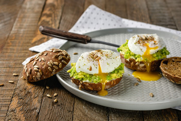 Sandwiches with avocado and poached egg.