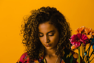 Close up of woman against yellow background