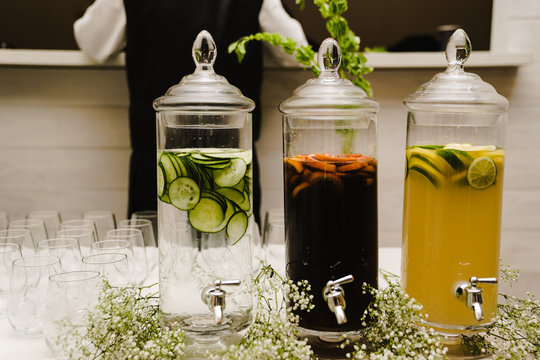 Variety of drinks in glass jar on table