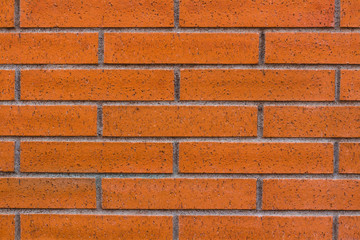 Brick background, orange and brown color. Wall of bricks