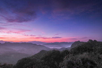 sunrise at Ban Ja Bo, mountain view misty morning above hill tribes village and top mountain around with sea of mist with colorful vivid sky background, Ban jabo village, Mae Hong Son, Thailand.