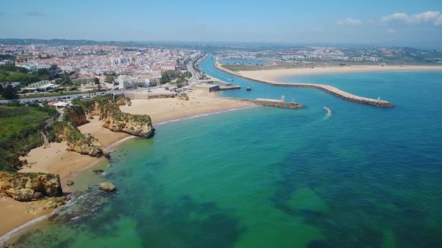 Aerial. Beautiful Portuguese beaches and shores of the city of Lagos. View from the sky, Algarve.