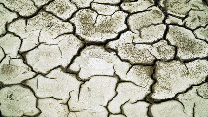Dry cracked soil, Arid climate. Volcanic landscape around volcano. mountainous relief after volcanic eruption