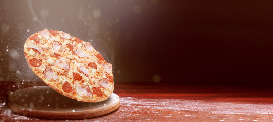 classic pizza on a dark wooden table background and a scattering of flour. pizza restaurant menu...