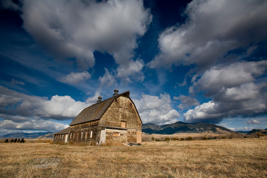 Old barn against backdrop of Bridger Mountains, Bozeman, Montana