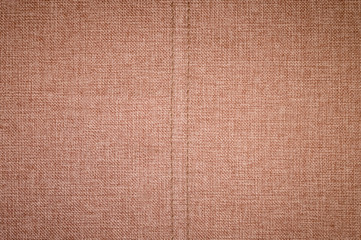 Textured background surface of textile upholstery furniture close-up. burlap brown Color fabric structure
