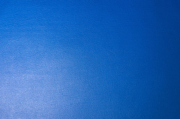 Textured background surface of textile upholstery furniture close-up. Blue color fabric structure