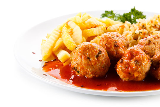 Meatballs with french fries and vegetables