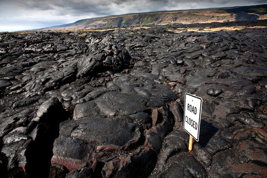 VOLCANOES NATIONAL PARK, HAWAII: A road closed from lava flow.
