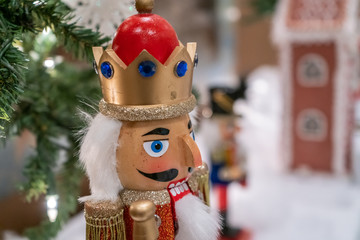 Close up View of Wooden Toy With Christmas Decorations in the background