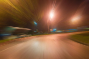 Fototapeta na wymiar Night traffic with futuristic motion blur & zoom effects.