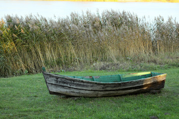 Wooden boat parked on land