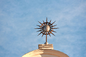 Fototapeta na wymiar Solar symbol on sky background. Common solar symbols in circles with rays crosses circle. Religious symbolism. Symbol of sun