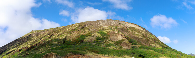 Fototapeta na wymiar Kualoa mountain range panoramic view, famous filming location on Oahu island, Hawaii