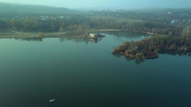 Aerial footage over Echo Park Lake, Kishinev, Moldova republic of. View of lake and smille bridge.