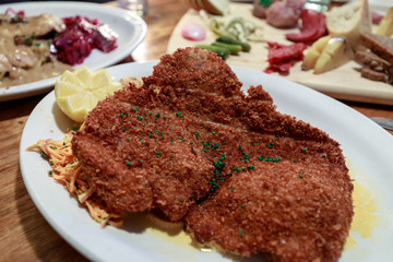 German pork schnitzel and fried potatoes