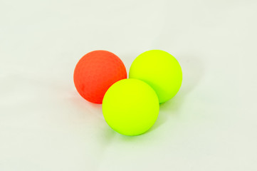 three colored golf balls