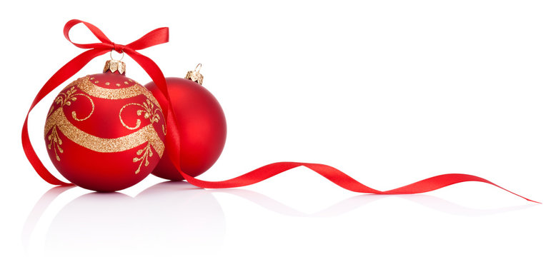 Two red Christmas decoration bauble with ribbon bow isolated on white background