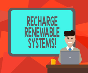 Word writing text Recharge Renewable Systems. Business concept for Clean and sustainable energy and nonpolluting Blank Bordered Board behind Man Sitting Smiling with Laptop Mug on Desk